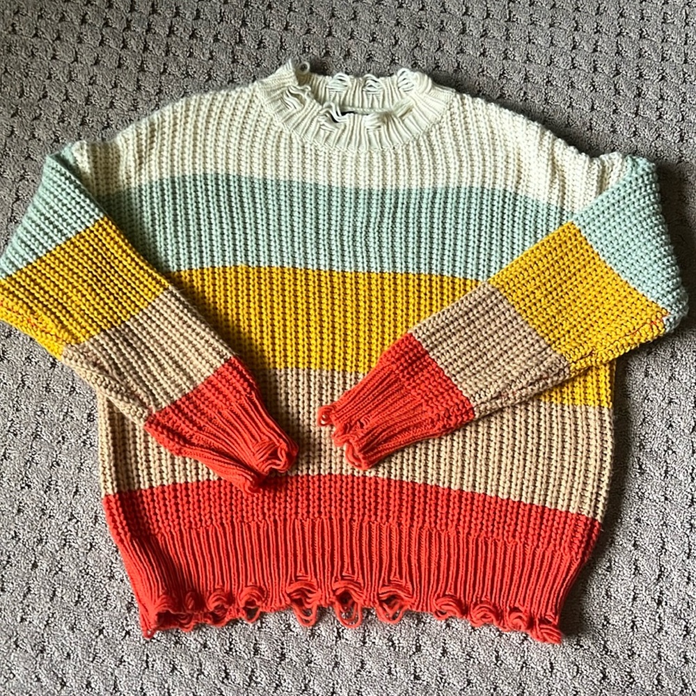 Racheal size medium multi colored sweater with sleeve and waist distressing